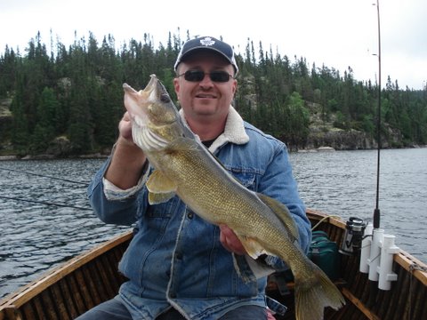 twins july 19-08 160.jpg - Norm with a beautiful Walleye.
